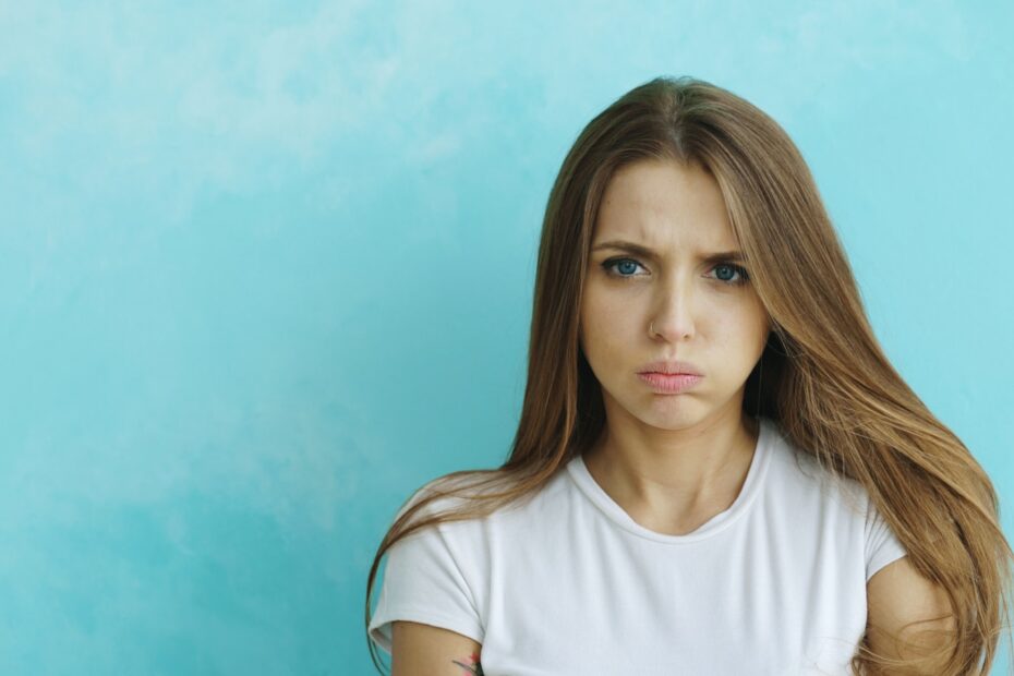 A young woman with a displeased expression